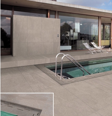 Moderne stenen pooltegels met een bullnose. Niet-glijdende betonnen tegels voor buiten terras.